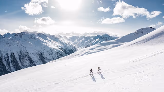 2 climbers on a snowy mountain